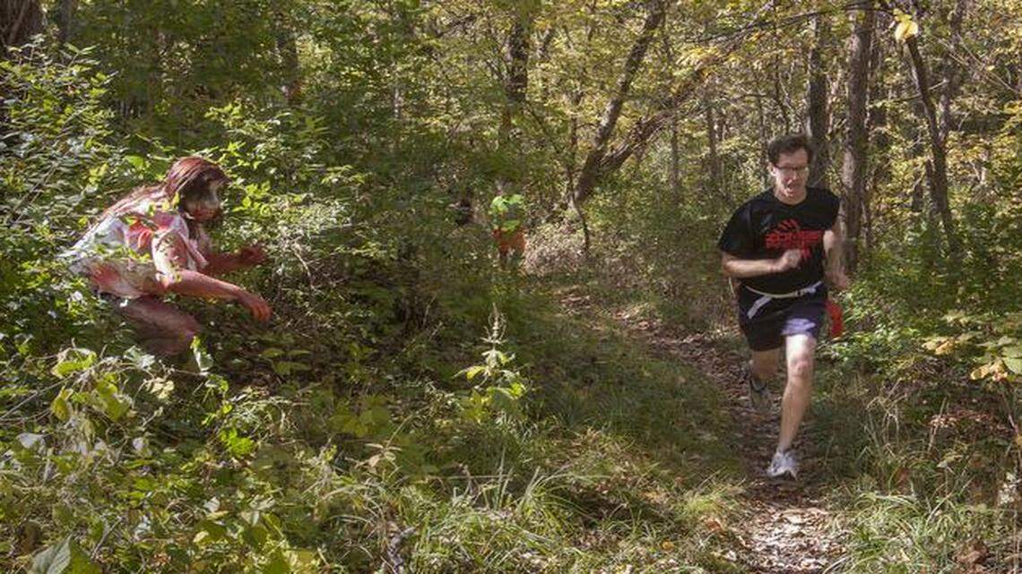 
Zombie for a day Summer Bell, 15, of Gladstone, jumped out at passing runners and tried to steal their flags Saturday at the first Zombie Frenzy, a 5K run at Stocksdale Park in Liberty.
