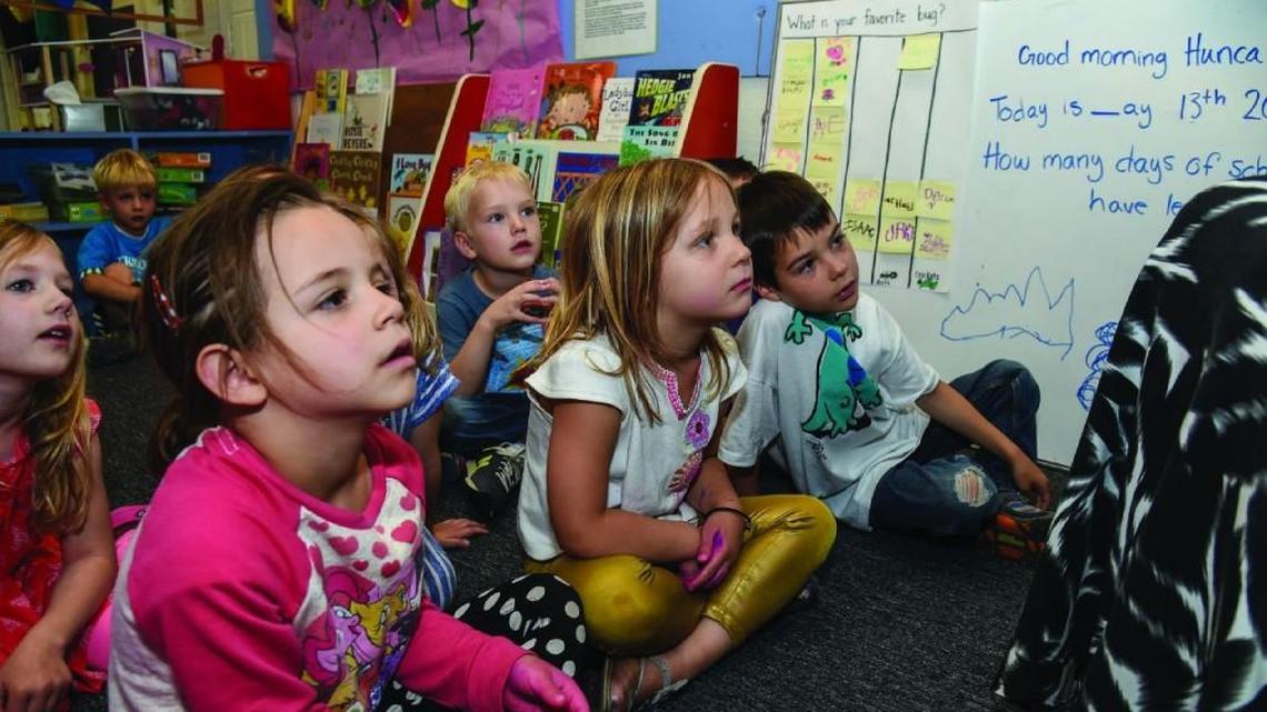 Children listened during a lesson at Denver’s Paddington Station Preschool.