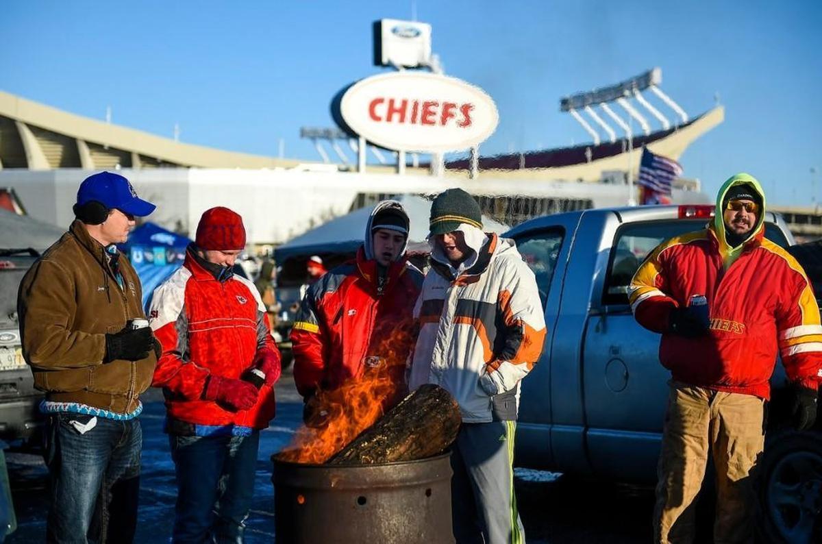 A barrel fire provided some warmth for Chiefs fans tailgating before the Titans game Sunday at Arrowhead Stadium.