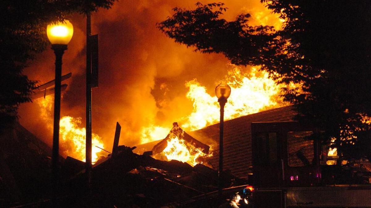 A three-story building collapsed Oct. 12 as Kansas City firefighters battled a blaze on Independence Boulevard. Firefighters John Mesh and Larry Leggio died.