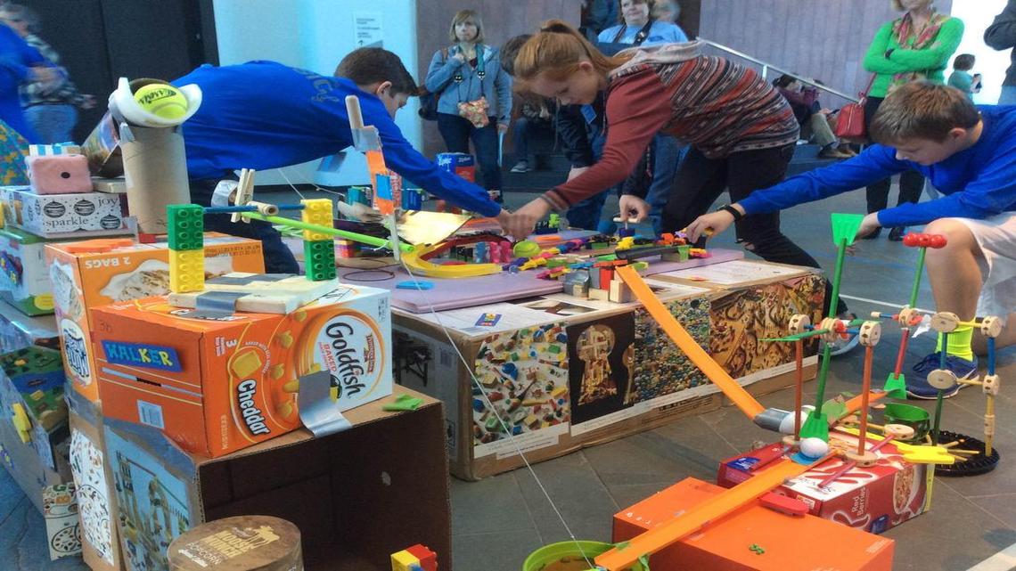 Teammates from Indian Woods Middle School get their Rube Goldberg machine ready to run.