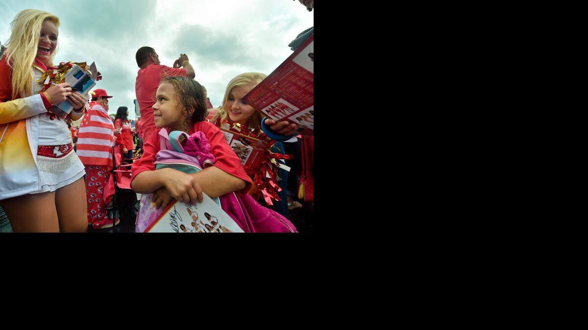 Kansas City Chiefs cheerleader Summer (left) added some spirit to Union Station’s centennial celebration Friday. Typhanee Hildebrandt, 7, enjoyed the festivities and had cheerleader Ashley sign her T-shirt.