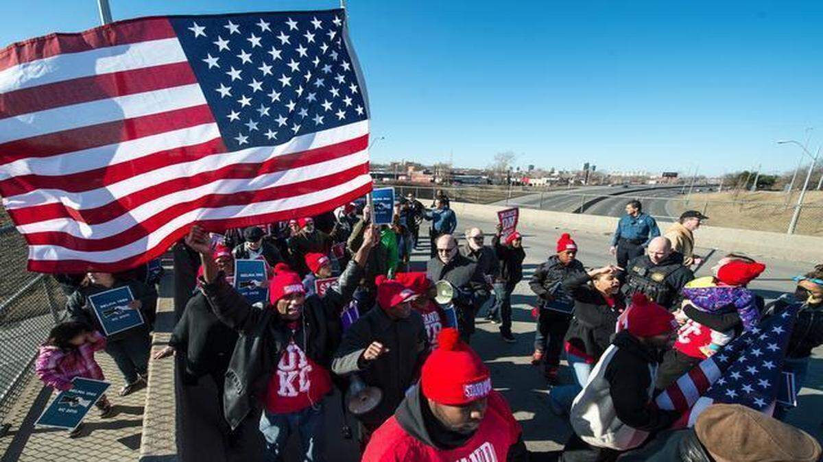 
A group of protesters marched across the Prospect Bridge at Interstate 70 Saturday morning, in honor of the civil rights activists who tried 50 years ago to cross the Edmund Pettus Bridge in Selma, Ala., on “Bloody Sunday.” The Kansas City protest was organized by Stand Up KC and the Metro Organization for Racial and Economic Equity.
