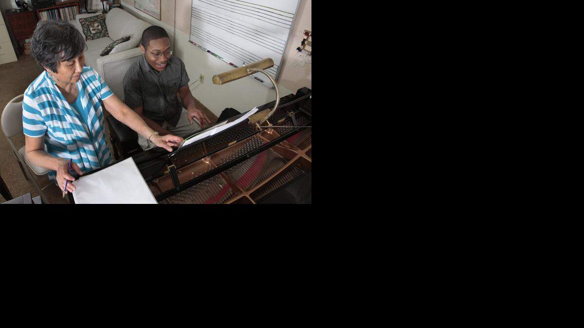 
Self-taught pianist Charles Askew, 17, has just started lessons with piano teacher Joyce Berg. She says an original piece he wrote, “Tempestuous Wait,” is “stunning.” Charles taught himself to use a complex music notation software in its composition.
