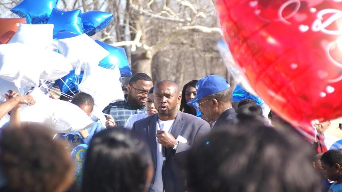 Damon Daniel, the president of the AdHoc Group Against Crime, spoke Saturday at a vigil for Inous Revels, who had been missing for 30 days before her body was found in Brush Creek.