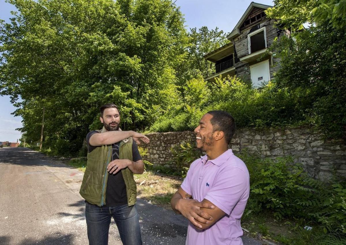 In 2017, Daniel Edwards, (right) and his friend Bo Nelson stood on Michigan Avenue in front of the abandoned house that they hoped would be the centerpiece of the Movement KC housing development. Nelson later quit the project, the house was demolished and Edwards has been unable to move the project forward.