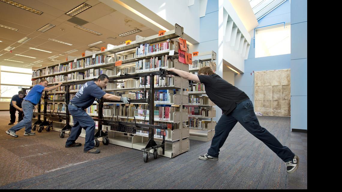 Nearly 140 loaded bookshelves were being moved to a holding area at the Johnson County Central Resource Library, 9875 W. 87th St. in Overland Park, in April to make way for renovations. 