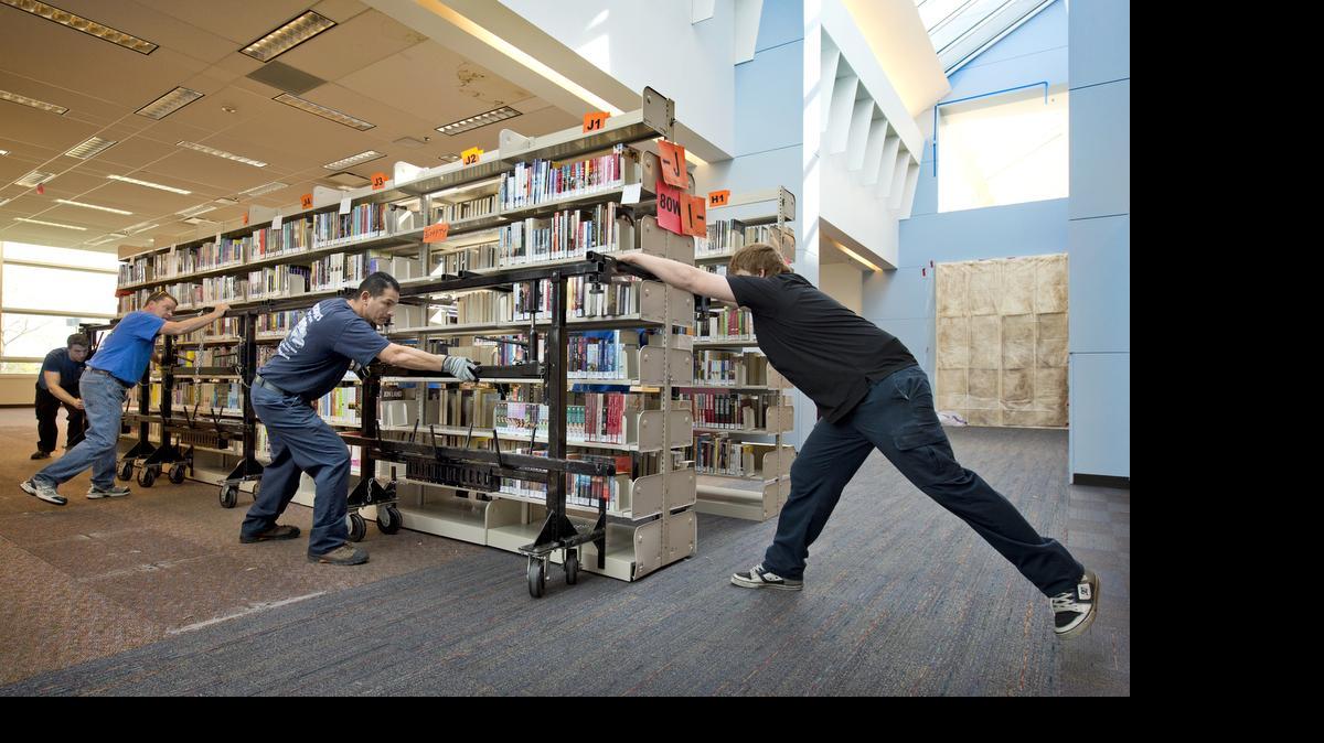 Nearly 140 loaded bookshelves were being moved to a holding area at the Johnson County Central Resource Library, 9875 W. 87th St. in Overland Park, in April to make way for renovations. 