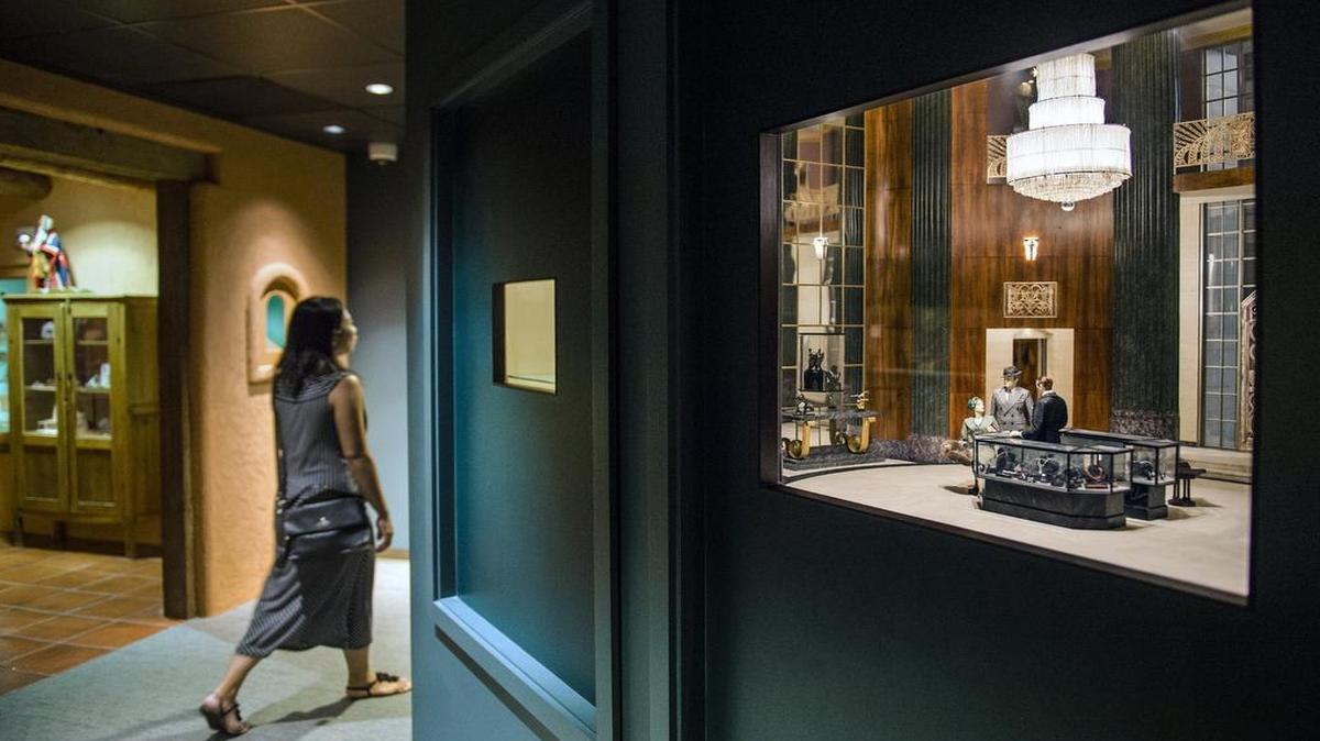 
The newest miniature display, known as a fine-scale miniature, in The National Museum of Toys & Miniatures is an Art Deco jewelry store completed in 2011. It was commissioned in honor of the museum’s 30th anniversary. A visitor walked by the display Saturday, the day the museum reopened after being closed for 18 months for renovations.

