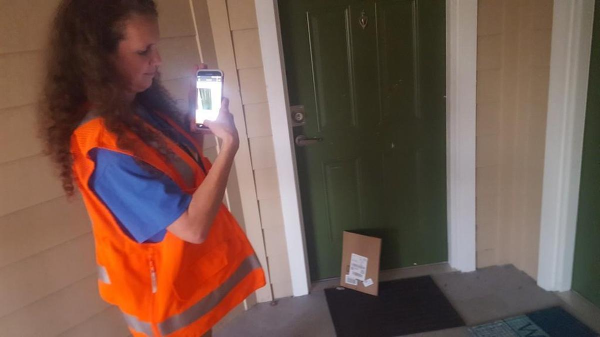 To prove she made the delivery, Pankrez has to take a photo of the package at the house.