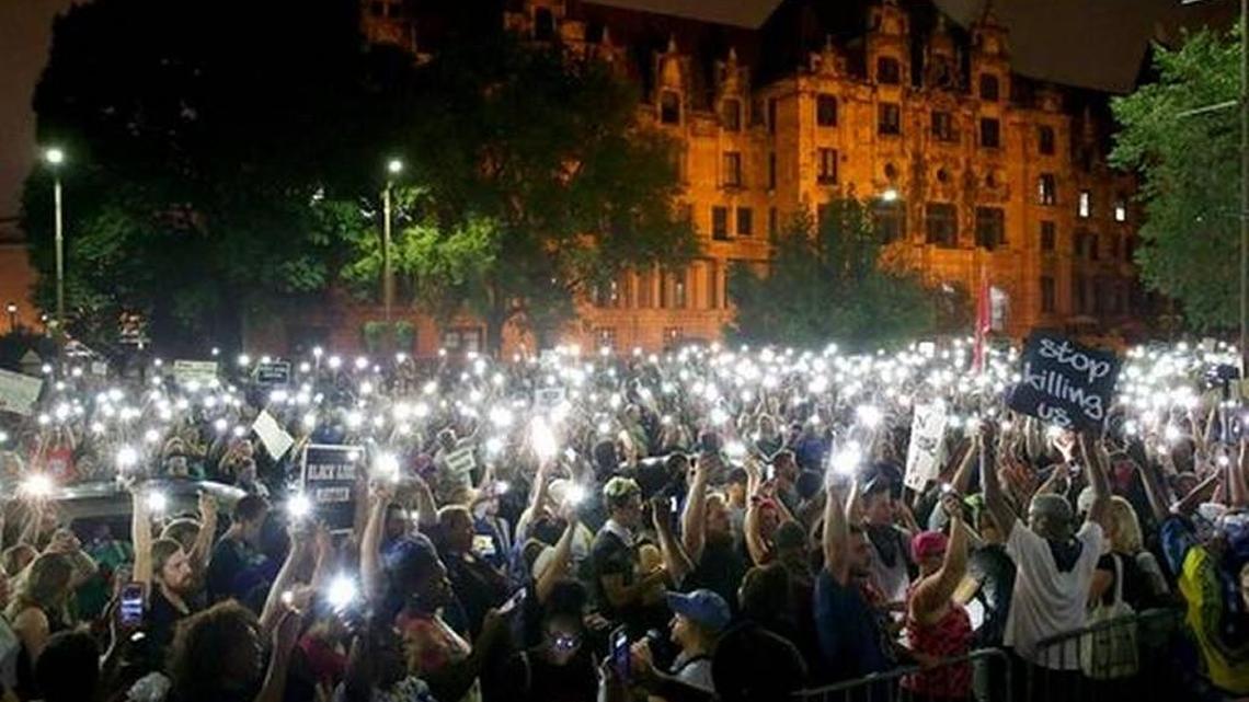 Protesters stand outside of the St. Louis city jail on Monday, Sept. 18, 2017. Police said that more than 120 people were arrested a day before including Drew and Jennifer Burbridge of Kansas City.