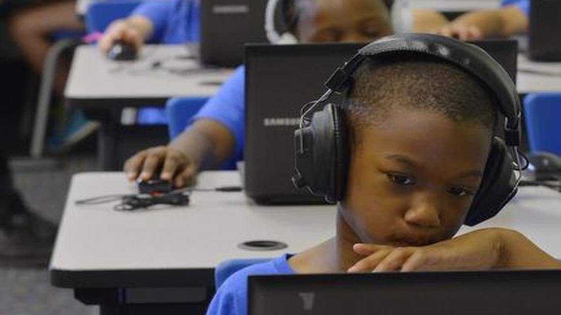 
Second-grader Deshawn Miller works on math problems in the computer lab.
