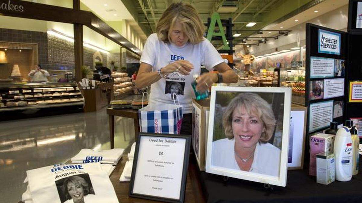 
Jan Helfer boxed donations of personal care items on Wednesday, Aug. 20, 2014, during a Deed for Debbie lunch event for Safehome at Queen's Price Chopper, 7201 W. 151st Street in Overland Park.
