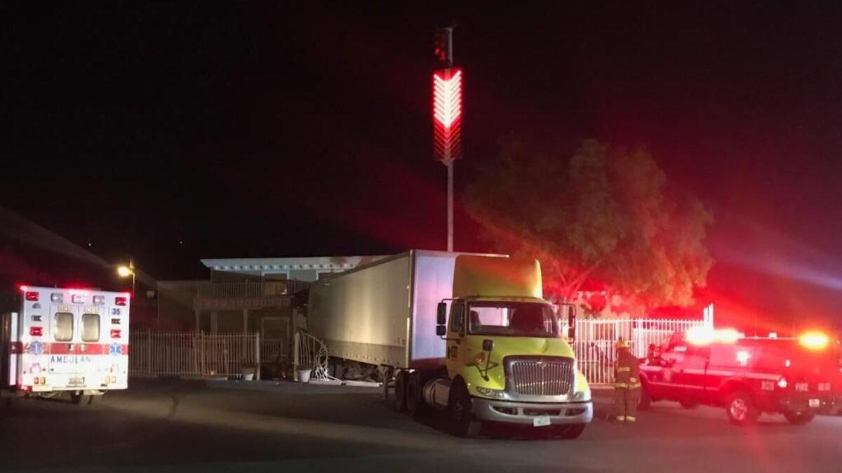 This photo provided by Moonlite Bunny Ranch owner Dennis Hof shows where a semi-truck crashed through the front gates and the front door of the brothel near Carson, Nevada.