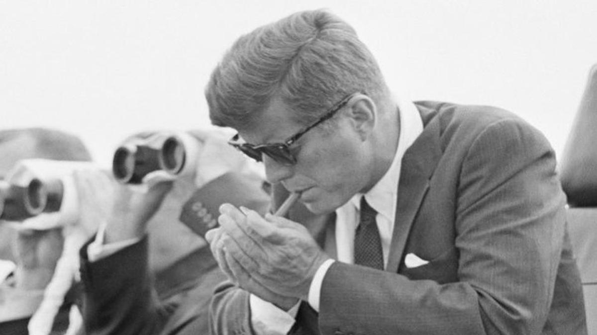 
President John F. Kennedy with, yes, a cigar.
