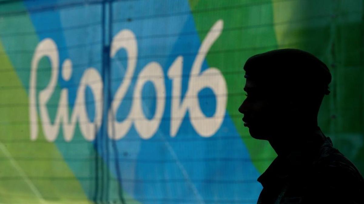 A guard stands in the Olympic athletes village in Rio de Janeiro, Brazil on Saturday, July 30, 2016. The games open on Friday.