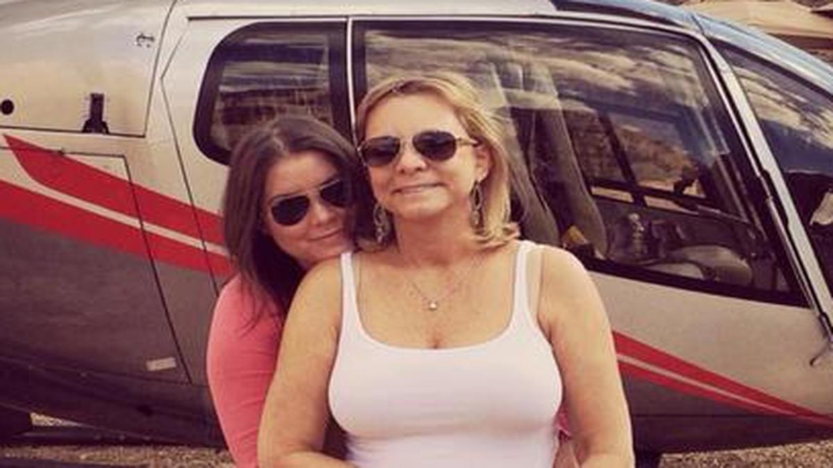 
In this Oct. 21, 2014, file photo provided by TheBrittanyFund.org, Brittany Maynard (left) hugged her mother, Debbie Ziegler, next to a helicopter at the Grand Canyon National Park in Arizona. 
