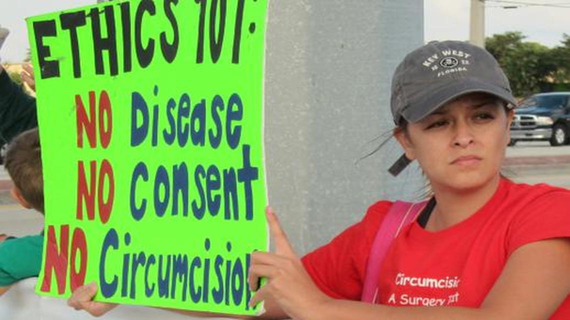 
Jennifer Blanchard of Miami protested earlier this month in Boynton Beach, Fla., over the case of a boy whose parents have been fighting over whether to circumcise him. 
