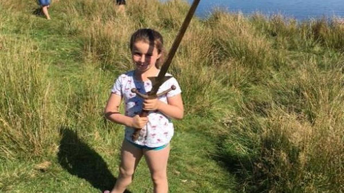 Matilda Jones, 7, was paddling waist-deep in Dozmary Pool on Bodmin Moor last week when she came across a sword.