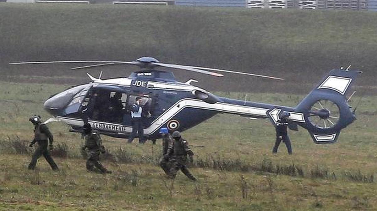 
Police forces take positions in Dammartin-en-Goele, northeast Paris, as part of an operation to seize two heavily armed suspects, Friday.
