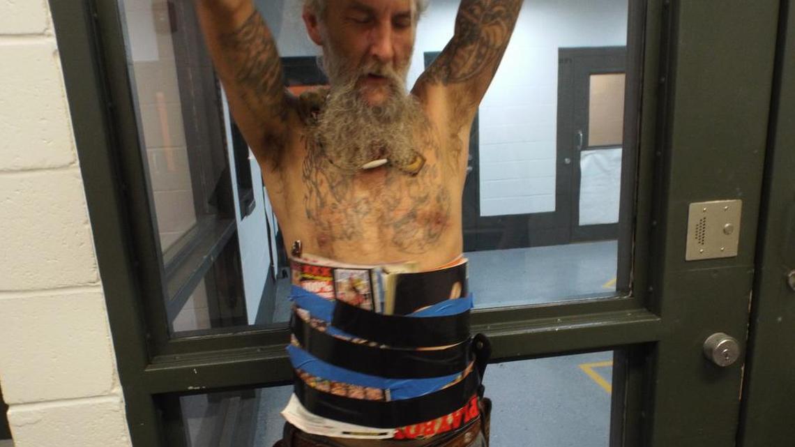 Donald Gene Gaither taped adult magazines to himself for protection during a knife fight he tried to start Sunday in Oklahoma.