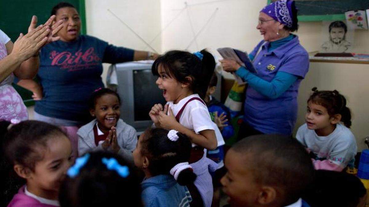 
Students and teachers celebrated Wednesday at a school in Havana after listening to a live, nationally broadcast speech by Cuba’s President Raul Castro about the country’s restoration of relations with the United States. 
