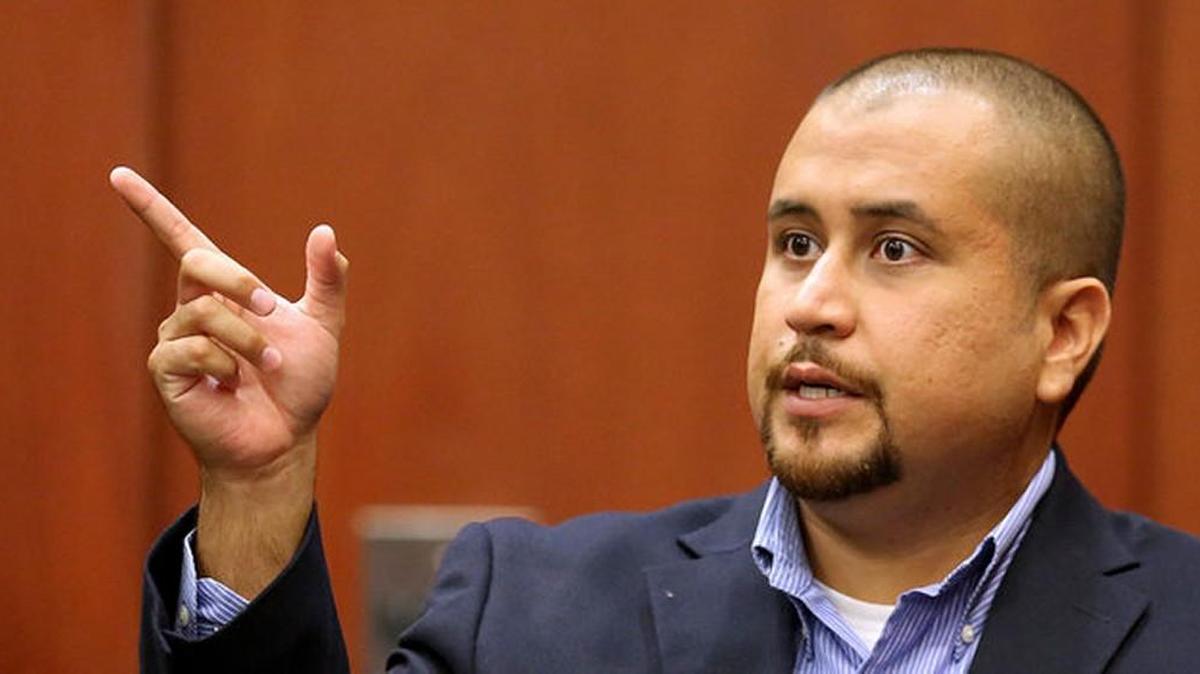 George Zimmerman allegedly got punched in a Florida restaurant after bragging about shooting Trayvon Martin, according to a police report.