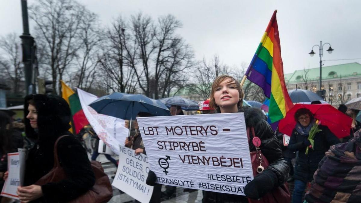 Women attended a march for gender equality and women’s rights Tuesday during the celebration of International Women’s Day on Gediminas Avenue in Vilnius, Lithuania. The poster reads, “Women’s strength in unity.”