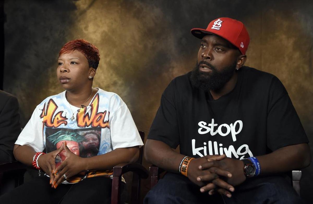 The parents of Michael Brown, Lesley McSpadden, left, and Michael Brown, Sr., right, talk to The Associated Press during an interview in Washington, Saturday, Sept. 27, 2014. Michael Brown's parents say they are unmoved by the Ferguson police chief's apology in their son's shooting death by a police officer. Instead, McSpadden and Brown Sr. told The Associated Press they would rather see an arrest, and Brown Sr. said he wants the police officer "in handcuffs." 