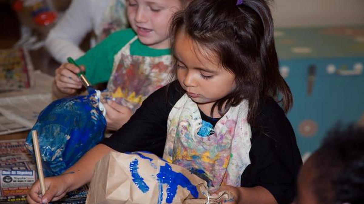 
In this photo provided by Transition House, a homeless shelter in Santa Barbara, Calif., Melody, 4, made a paper whale after listening to a story about whales during the Transition House’s Technology and Literacy for Children story time. A new report released Monday by the National Center on Family Homelessness says that one-fifth of America’s homeless children are in California. 
