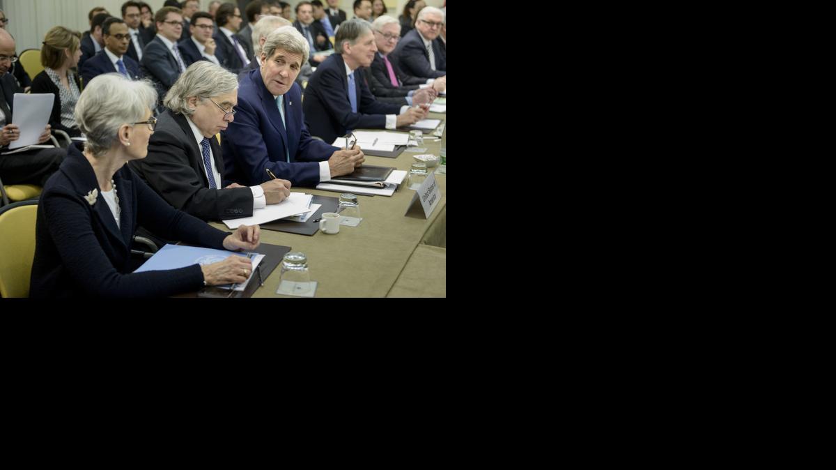 
U.S. Secretary of State John Kerry, third left, chats with U.S. Under Secretary for Political Affairs Wendy Sherman, as U.S. Secretary of Energy Ernest Moniz, second right, takes a note
