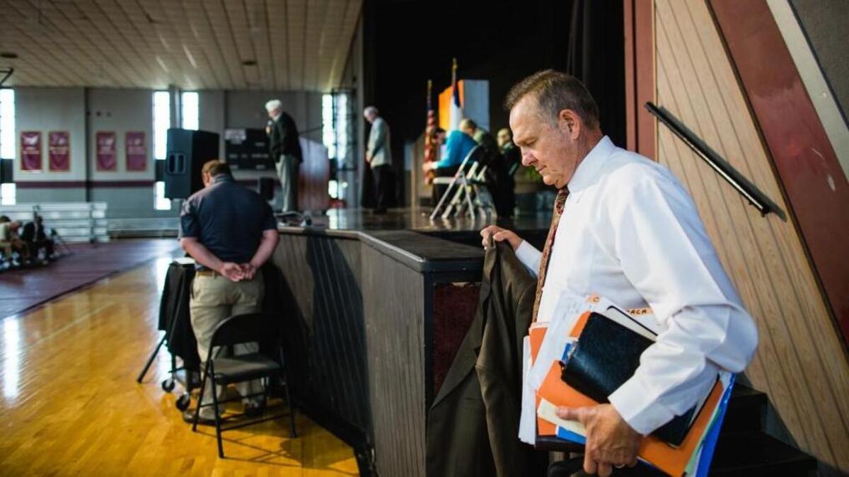 Judge Roy Moore, accused on Thursday of inappropriate sexual behavior toward four teenage girls when he was in his 30s, paused for a closing prayer of blessing over his campaign at a “Faith and Family Rally” in Florence Alabama at Shoals Christian School on Sept. 17.