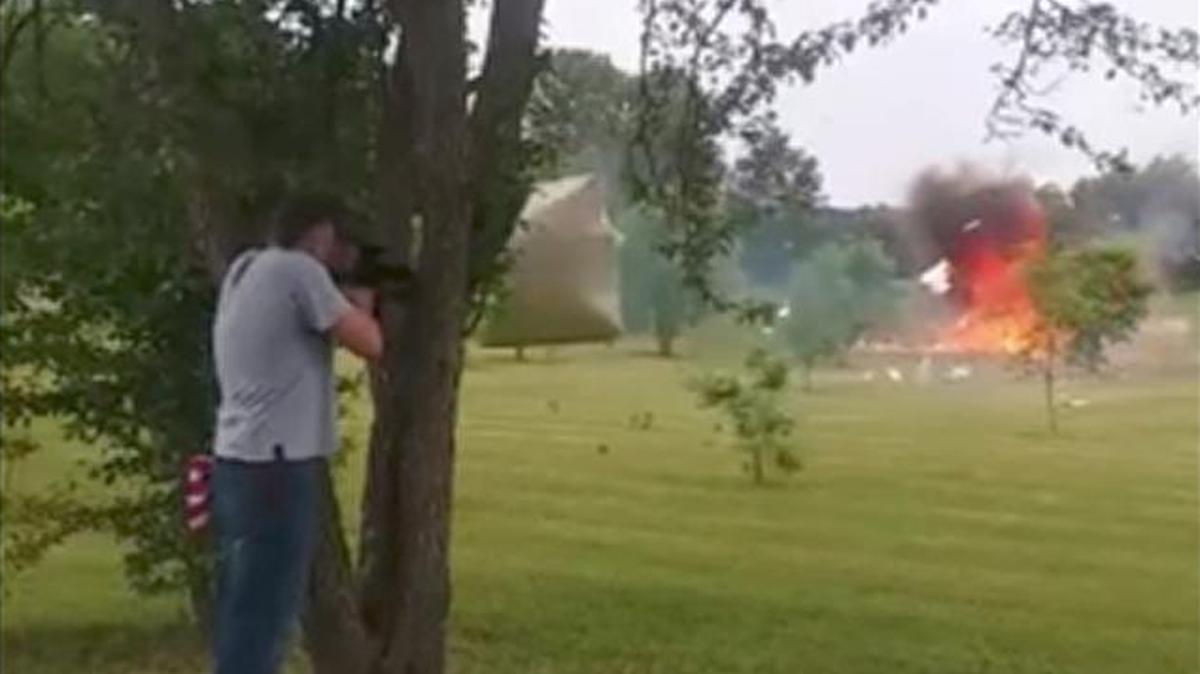 A man shooting at a refrigerator full of explosives came within inches of losing limb or life when the door came flying at him.