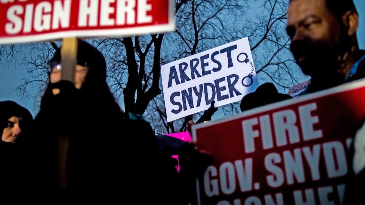 Marchers outside of Flint City Hall protest Michigan Gov. Rick Snyder’s handling of the water crisis