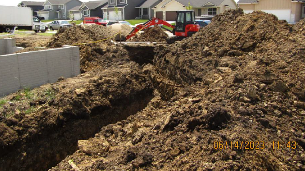 A worker was buried alive under dirt in a workplace accident in Iowa, according to a lawsuit.