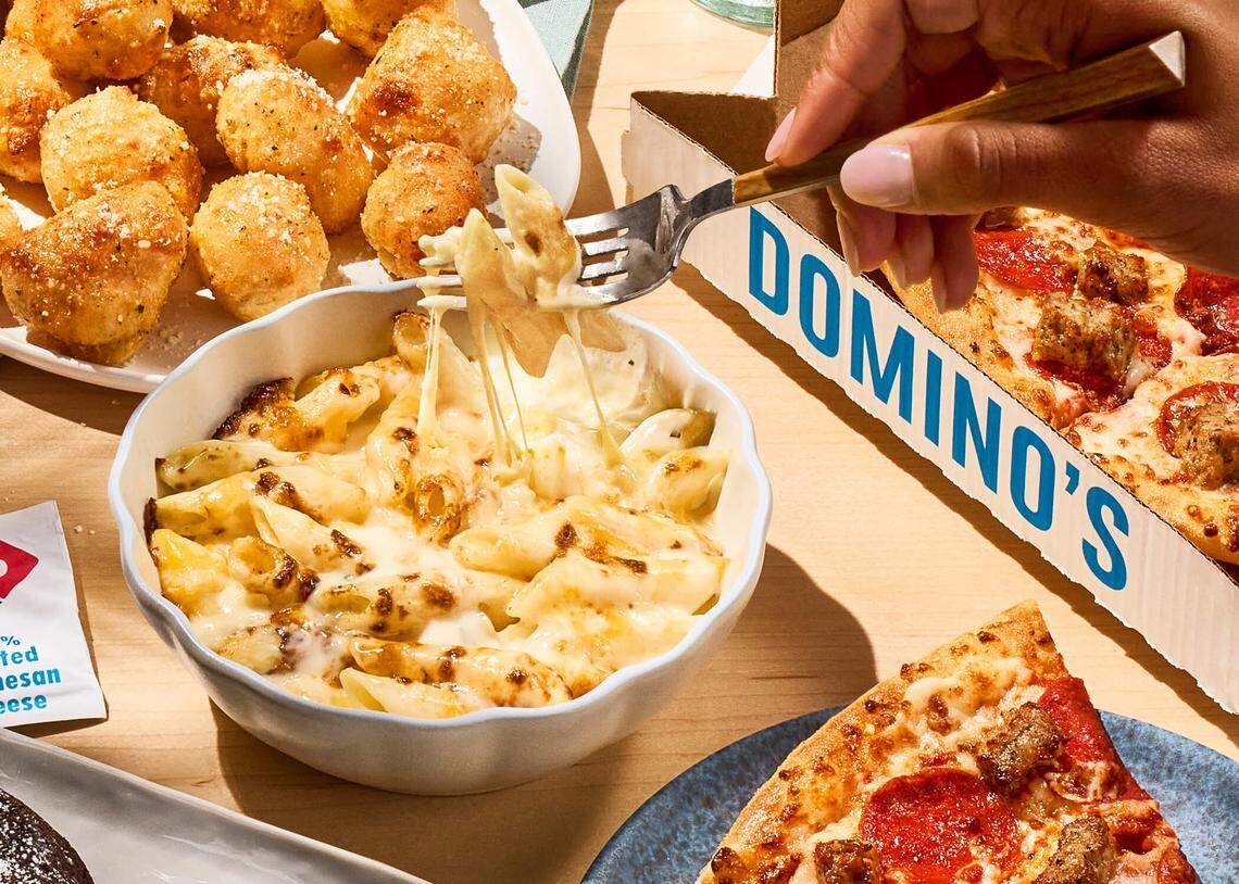 Domino’s oven-baked mac and cheese is available in two varieties: five-cheese and spicy buffalo.