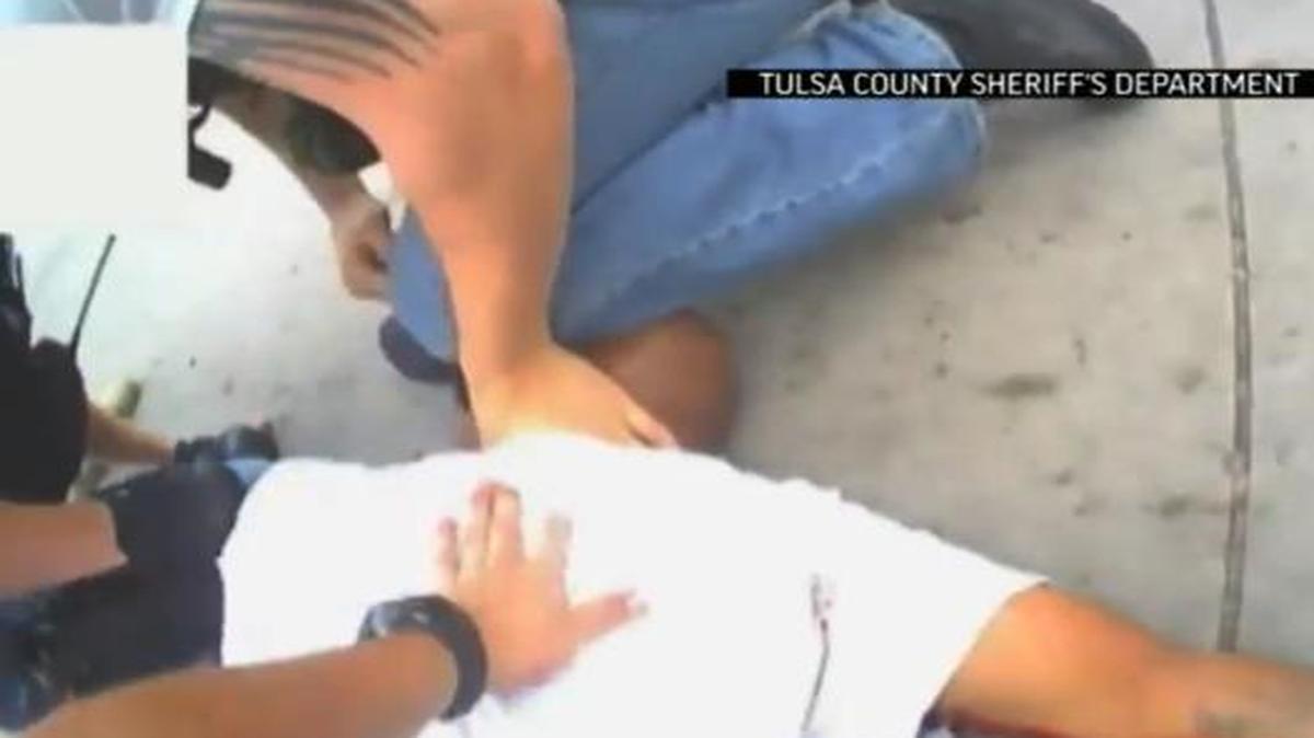 
In this screen shot from video provided by the Tulsa County Sheriff's Office, police restrain 44-year-old Eric Harris after he was chased down and tackled by a Tulsa County Deputy, and then shot by a reserve sheriff's deputy while in custody, in Tulsa, Oklahoma
