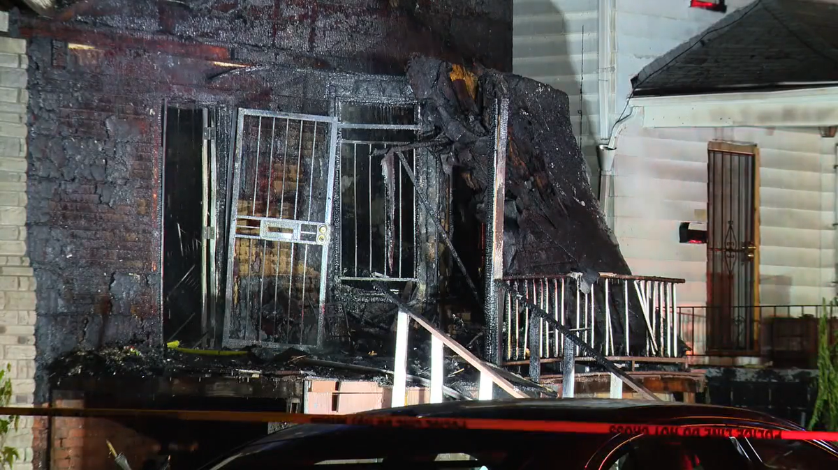 A Michigan woman is being held without bond after officials say she set fire to a home with three people inside, killing one of them.