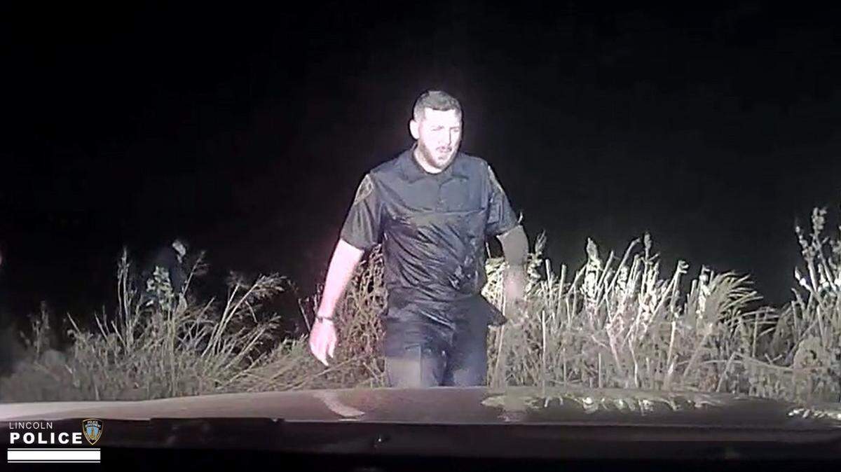 A police officer saved a drowning woman “screaming for help” after her kayak capsized, Nebraska officials said.