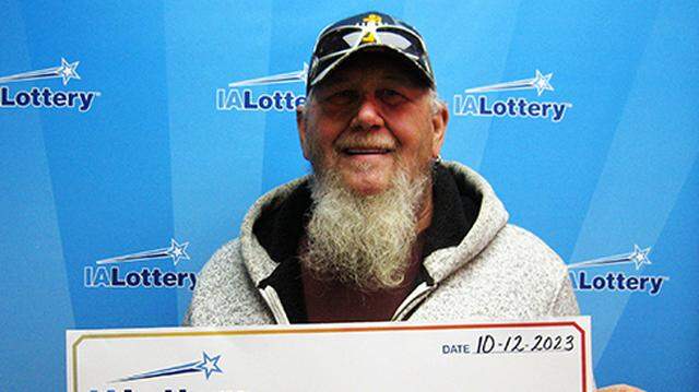 Mark Smith with his oversized check.