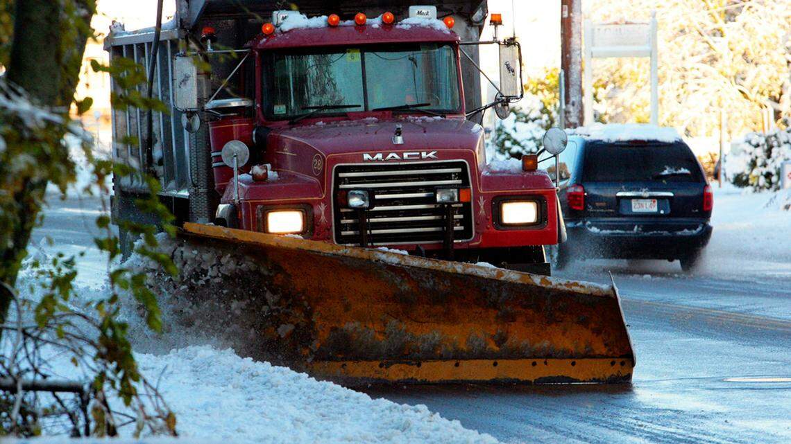 The operator of a snow plow, not the one pictured, is accused of driving drunk and running over a woman, killing her.