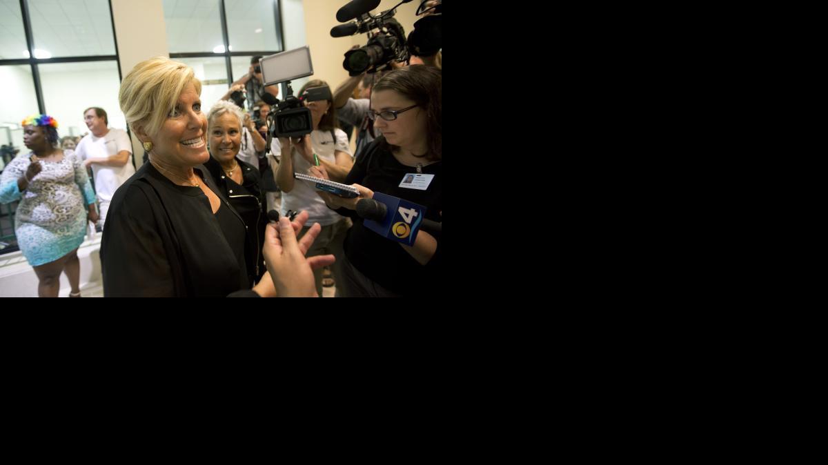 
Suze Orman and her spouse Kathy Travis talk to the media Monday before a group wedding in Delray Beach, Fla. 
