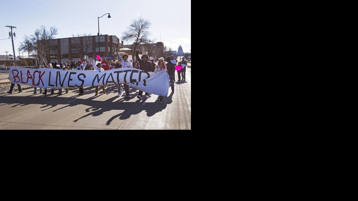 
People march Sunday, March 8, 2015, in Madison, Wis., following the shooting death of Tony Robinson
