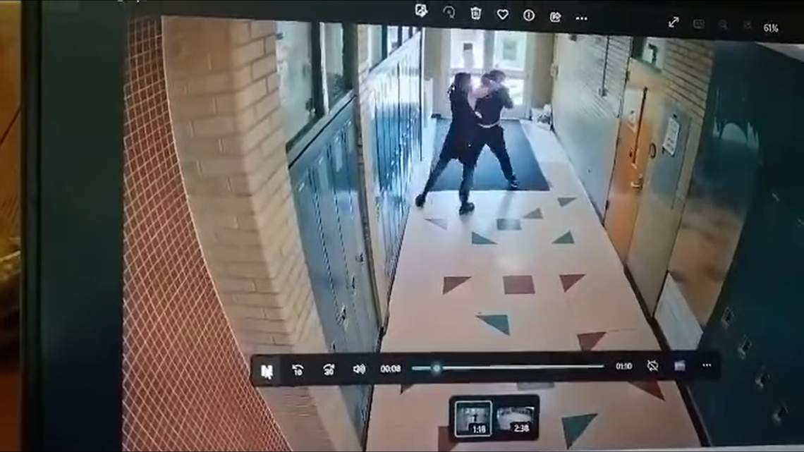 A Michigan coach has been fired after surveillance video showed him attack a student from behind and choke him.