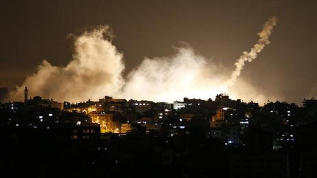 
Smoke from flares rose over Gaza City on Thursday. Israel launched a large-scale ground offensive in the Gaza Strip, escalating a 10-day military operation to try to destroy Hamas' weapons arsenal, rocket-firing abilities and tunnels under the Palestinian territory's border with Israel. 
