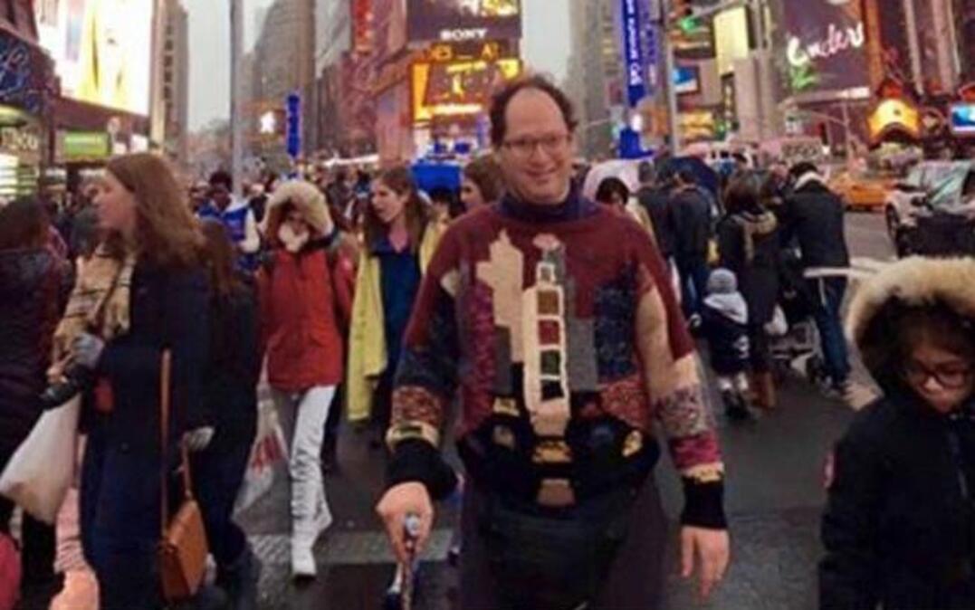 Sam Barsky of Baltimore knits sweaters of landmarks — then visits them and takes a photo of himself wearing the sweaters there.
