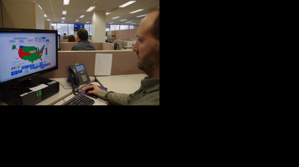 
A researcher simulates a check done for the National Instant Criminal Background Check System or NICS, at the FBI’s criminal justice center in Bridgeport, W.Va. 

