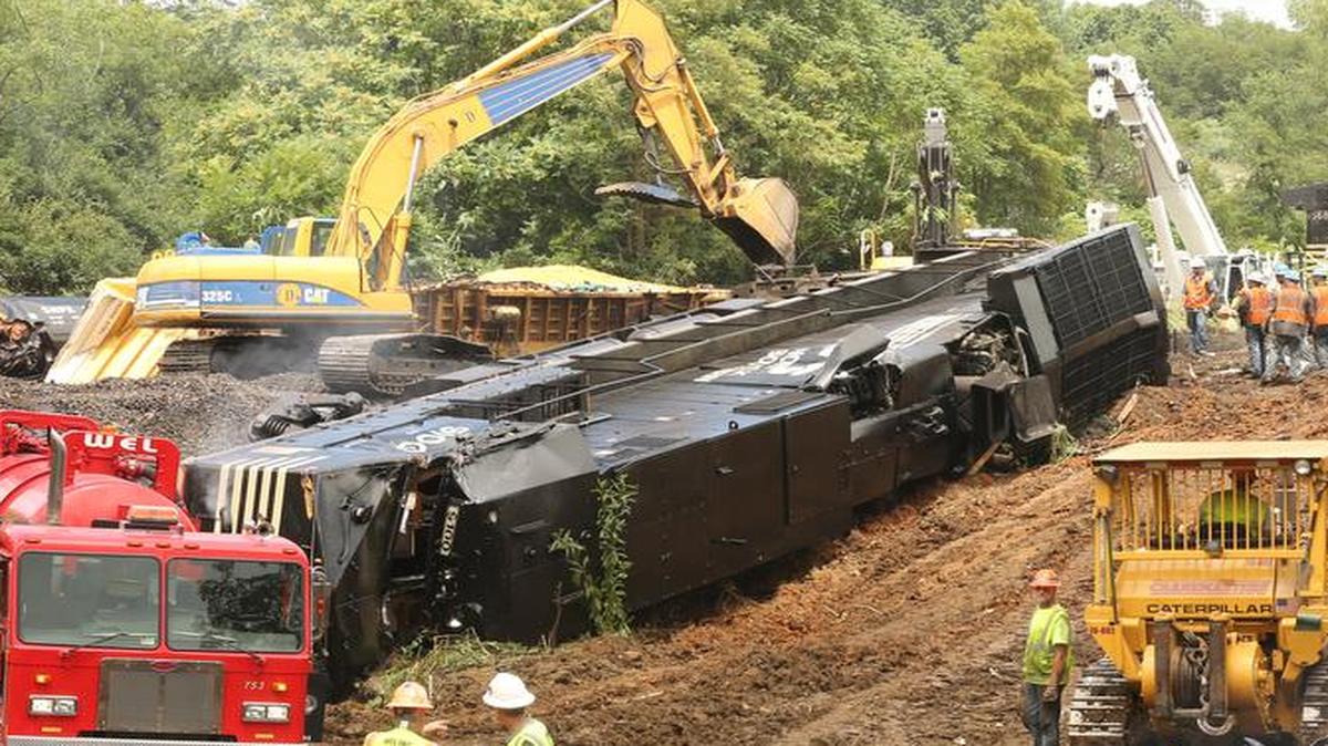 
Crews work on the site of a train derailment in Dublin Va. Wednesday, July 15. More than 20,000 gallons of lube oil spilled from a derailed car Tuesday afternoon when a westbound Norfolk Southern train rear-ended another NS train near Dublin, according to a Norfolk Southern release. 
