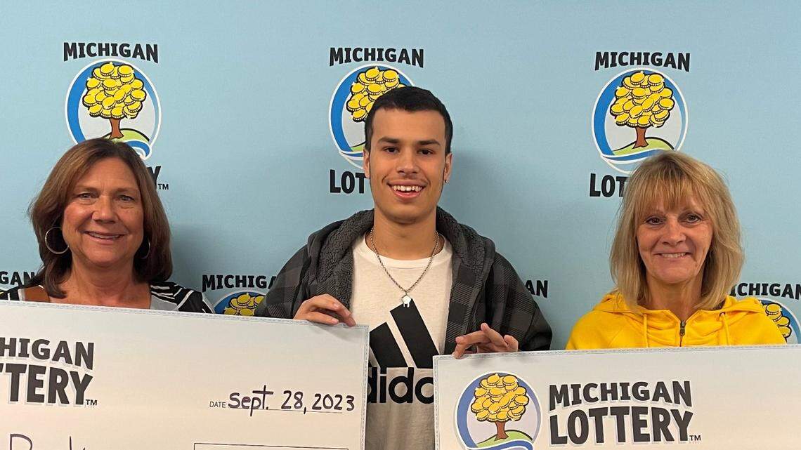 Members of the Rak Pack lottery club accepted their $1 million Powerball prize Sept. 28.