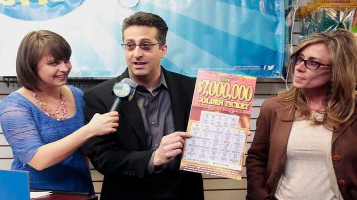 
New York State Lottery rep Gretchen Dizer with Joseph Amorese of Easton, Pa., and his wife Jodi
